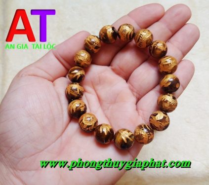 Vòng đeo tay đá mắt hổ chạm rồng 