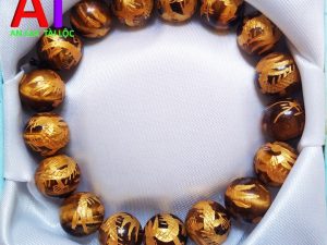 Vòng đeo tay đá mắt hổ chạm rồng